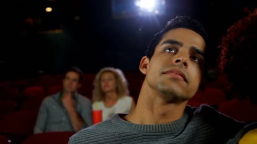 Couple watching movie in theater