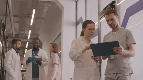 Healthcare Professionals Collaborating in Modern Hospital Setting