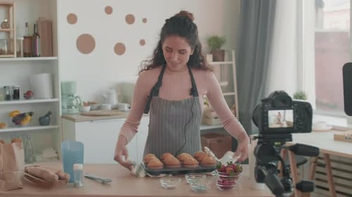 Female Caucasian Blogger with Muffins