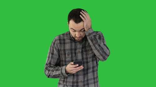 Worried Young Adult Using Mobile Phone