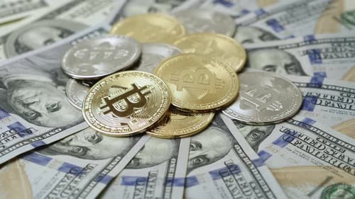 Bitcoin Coins on US Dollar Bills
