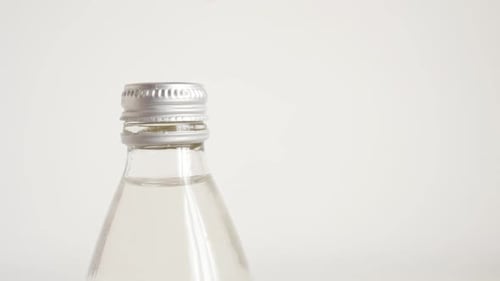 Opening Clear Liquid Bottle