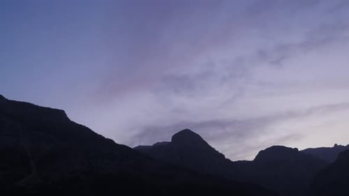Mountains at Sunset with Vibrant Purple and Pink Sky
