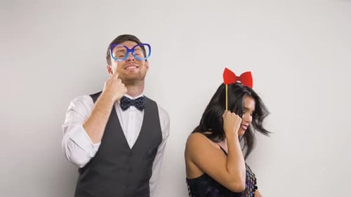 Young Adults Dancing with Photo Booth Props