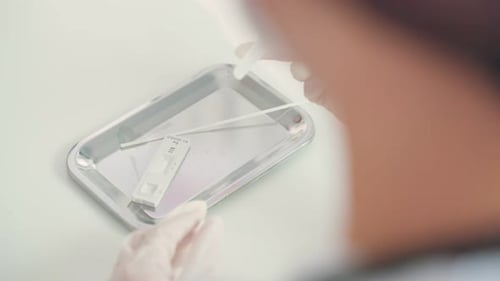 Close up of Asian specialist doctor diagnosis PCR Coronavirus sample.