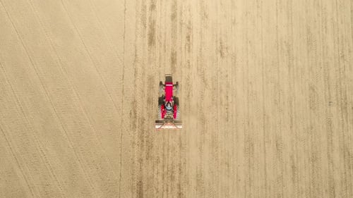 Tractor at Work in Field Top View