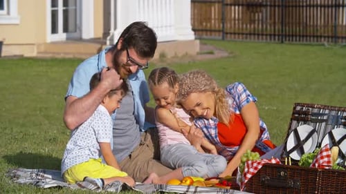 Happy Family Picnic on a Summer Day