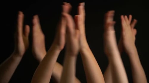 Multiple Arms and Hands Clapping Together