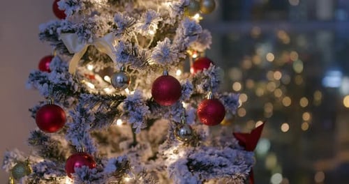 Christmas Tree in an Urban Apartment at Night