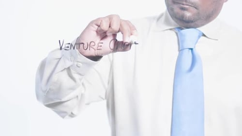 Asian Businessman Writes Venture Capital