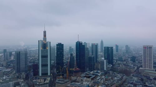 Aerial Descending Footage of Cityscape with Downtown Skyscrapers