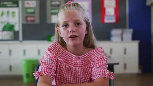 Young Girl Talking at School in Classroom