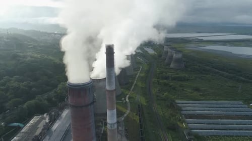 Aerial Drone View of Smoking Pipes and Cooling Towers of Coal Thermal Power Plant