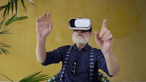 Senior Man Enjoys Immersive VR Experience at Home