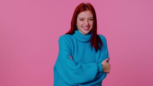 Smiling Ginger Happy Girl Blinking Eye Looking at Camera with Toothy Smile Winking and Flirting