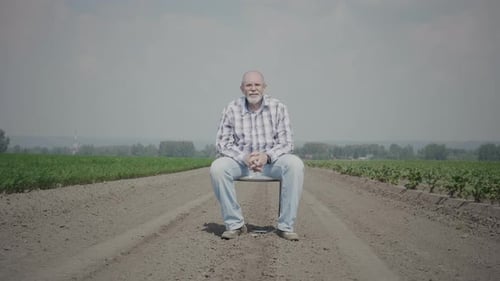Alone senior man in the field