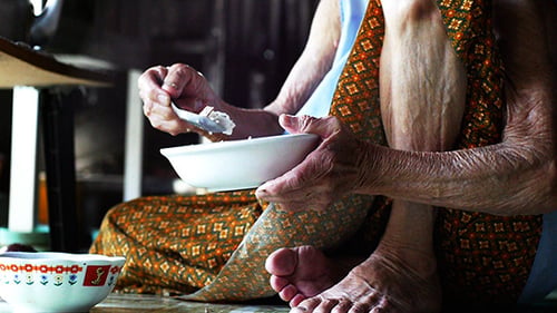Old Lady Eating Alone
