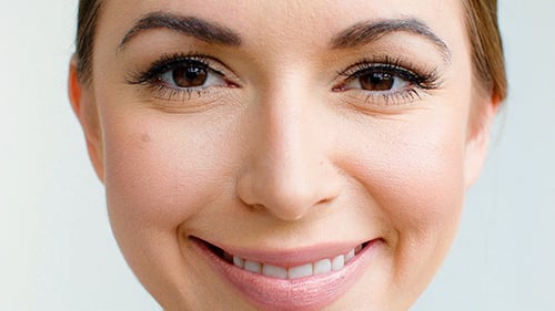 Woman Smiling Up Close