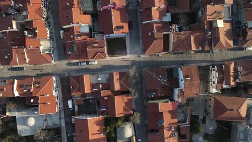 Overhead Drone Footage of City With Red Tile Roofs