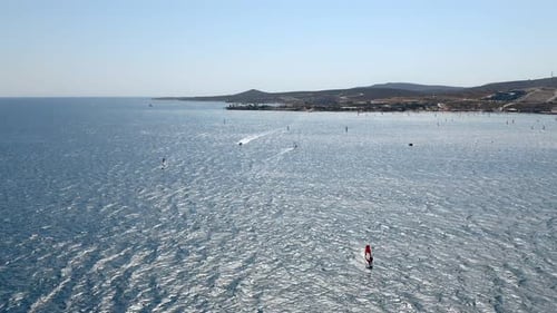 Windsurfers In Windy Ocean