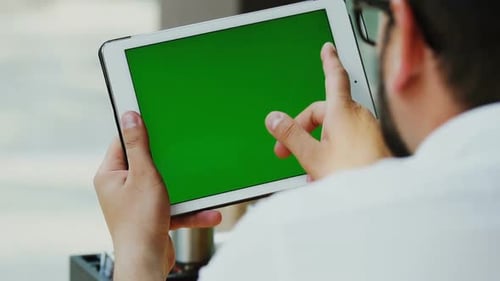 Close up of Freelancer Work on Touchscreen Pad Indoor