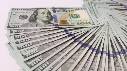 Benjamin Franklin portrait on 100 US dollar bill close up.