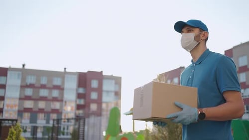 Delivery Man with Box Wearing Face Mask and Gloves