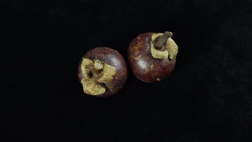 Exotic Mangosteen Fruit Still Life on Black Background