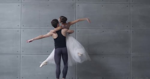 Graceful Ballet Dancers Perform a Routine Together