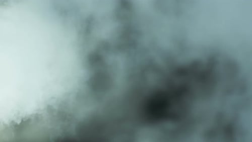 Abstract Smoke Plumes Drifting Against Dark Background