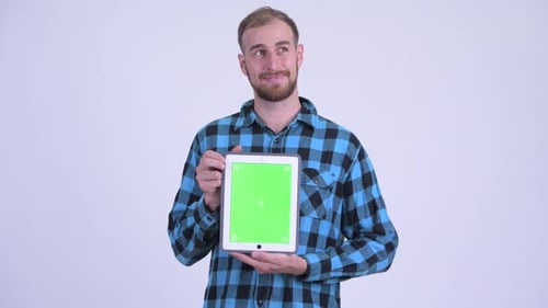 Man Holding Tablet With Green Screen Display