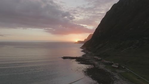 Panoramic View of the Ocean and the Sunsetting Behind the Mountain