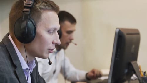 Male Call Center Agent in Wireless Headset Consulting Online ClienT