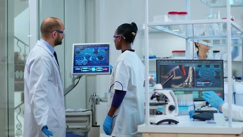 Scientists Collaborating on Research in Modern Laboratory