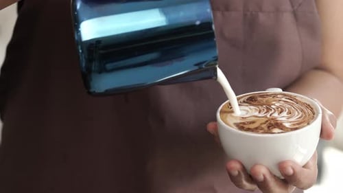Milk Being Poured to Create Latte Art Design