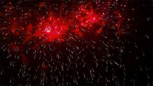 Colorful Fireworks Exploding Against Night Sky