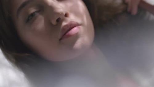 Beautiful Woman Lying Down Under Sheer Fabric
