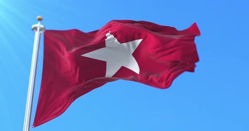 Realistic Red Flag with White Star Waving in Blue Sky
