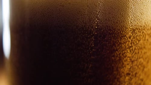 Close Up Dark Beverage and Condensation