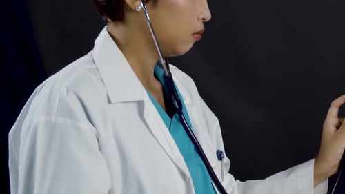 Medical Professional Checks Stethoscope in Studio Setting