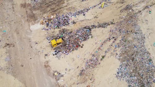 Aerial View of Bulldozer Working in Landfill Site