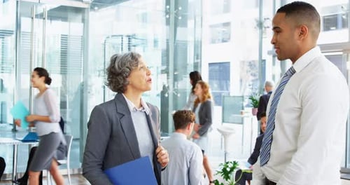 Businesspeople shaking hands in office
