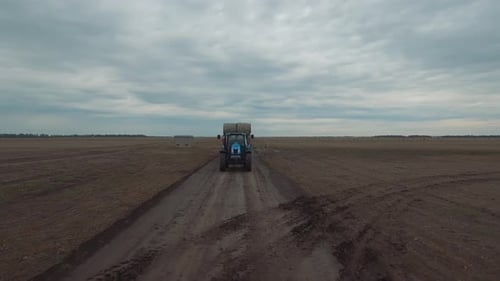 Tractor Driving On A Dirth Road
