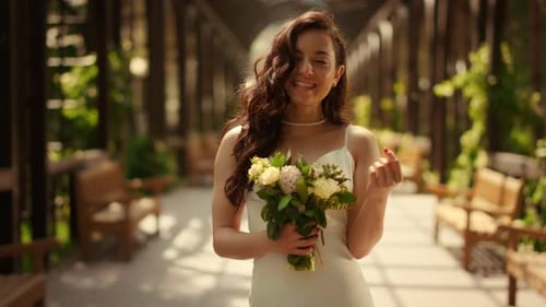 Radiant Woman with Flowers Smiling in Arbor