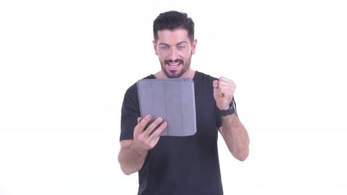 Excited Man Celebrating Good News on Tablet