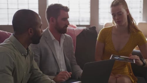 Young creative professionals working in a modern office