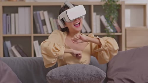 Woman Enjoys Virtual Reality Experience at Home