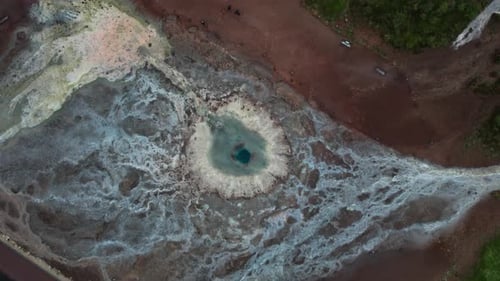 Drone Flight Over Geyser Pool And Surrounding Geothermal Landscape