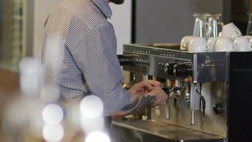 Barista Preparing Espresso Drink on Modern Machine