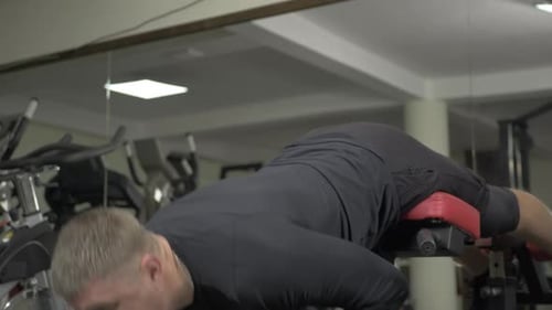Hyperextension Exercise on Roman Chair in the Gym